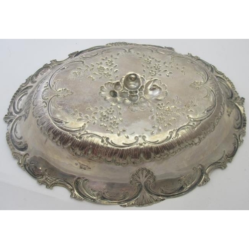 405 - A large oval white metal dish German Handarbeit 800. The centre embossed with fruit & flowers and ed... 