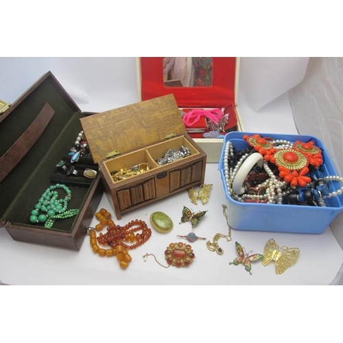 426 - A large collection of mainly vintage costume jewellery in four boxes (a leather jewellery box, a 195... 