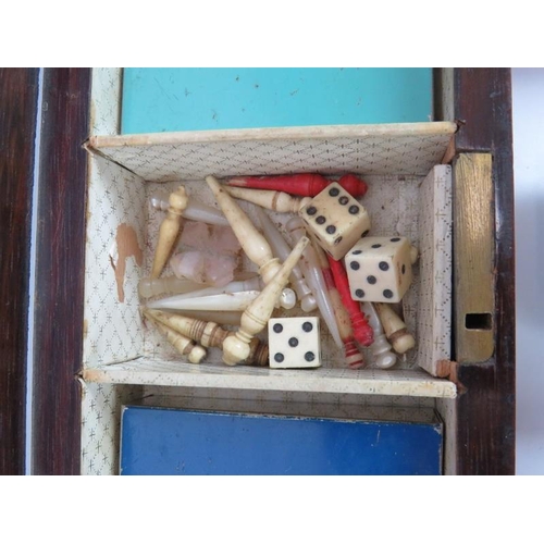 43 - A mother of pearl inlaid rosewood cribbage box with contents including pegs, playing cards & dice pl... 