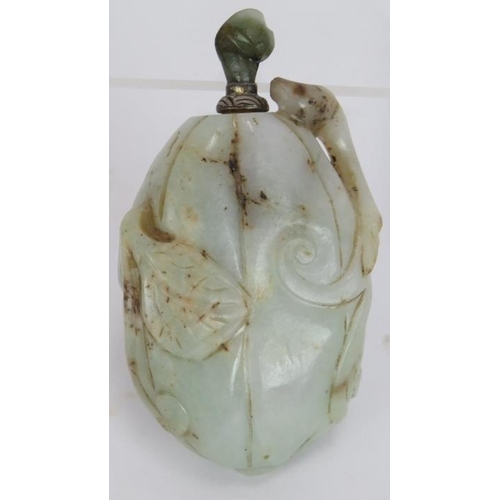 45 - A Chinese celadon & russet carved jade snuff bottle of melon form with white metal spoon. Length 8.5... 