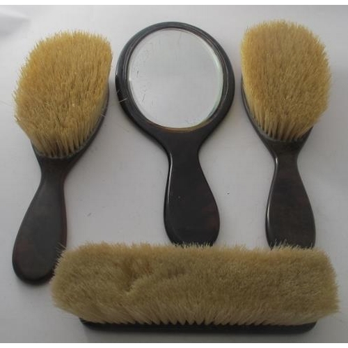 455 - A faux tortoiseshell five piece dressing table set, comprising of hand mirror, two hair brushes and ... 