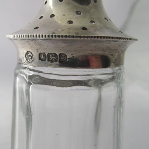 461 - A glass panel cut sugar caster with silver top, Sheffield 1924.
Condition report: Some scratching.