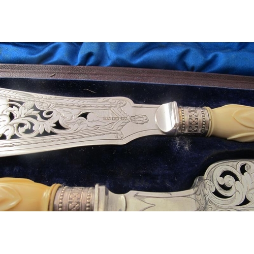 465 - A pair of plated fish servers with pierced decoration & fine engraving of a fisherman on the fish sl... 