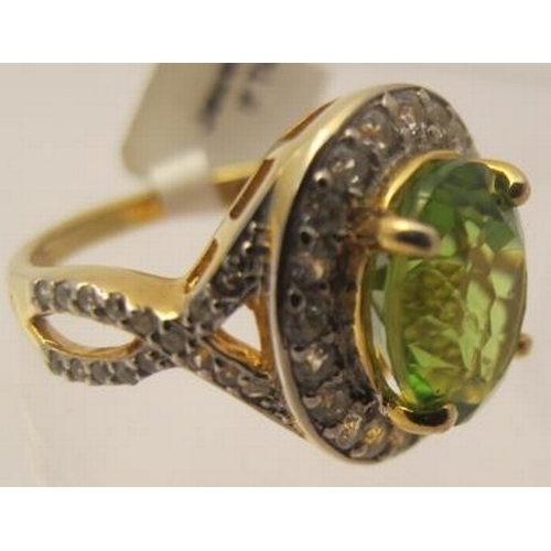 480 - Peridot gemstone ring, 17mm x 13mm portrait setting, ring size M/N, 14k yellow gold 925.