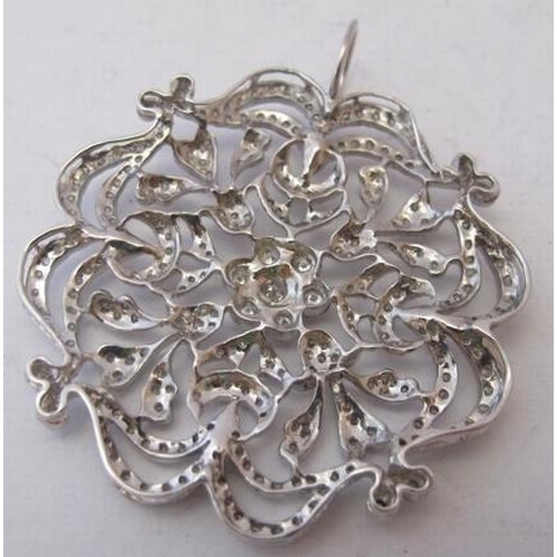 487 - A fine diamond & white metal snowflake pendant, inset with numerous diamonds, the centre diamond app... 