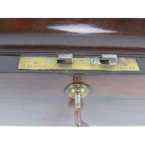 54 - A 19th Century brass bound rosewood writing slope with working Bramah lock, flush handles and docume... 