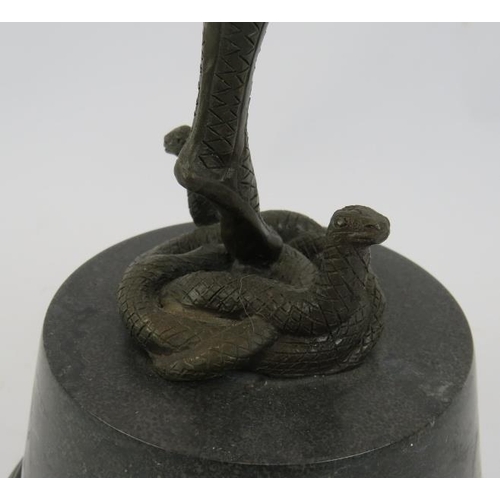 6 - A bronze figure of a snake dancer in the Art Deco style, mounted on a black marble plinth, unsigned.... 