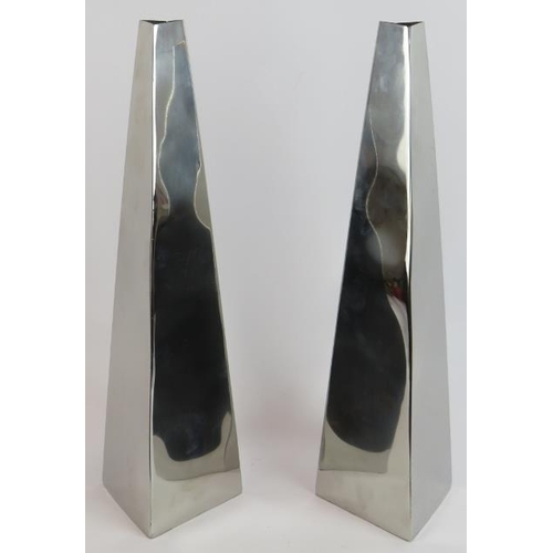 61 - A pair of contemporary polished stainless steel minimalist vases of rhomboid form. Height 42cm (2).
... 