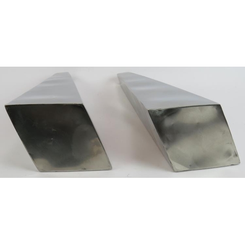 61 - A pair of contemporary polished stainless steel minimalist vases of rhomboid form. Height 42cm (2).
... 