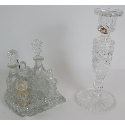 64 - A four piece cut crystal dressing table set, three similar covered jars, a cut glass candlestick and... 