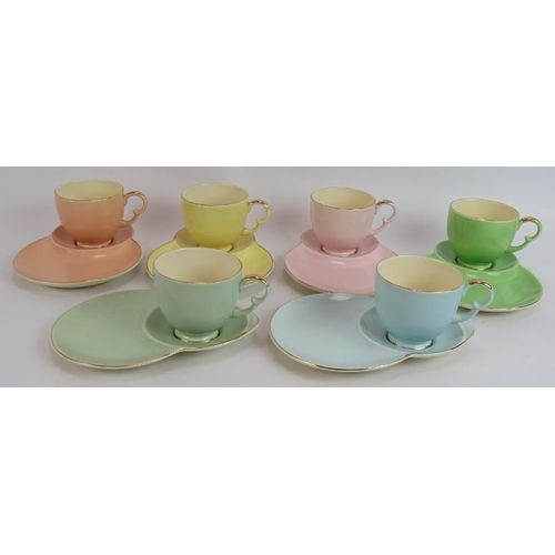 66 - A 12 piece Crown Devon pastel set of tennis cups & saucers plus an ivory & gilt Carlton Ware dish (1... 