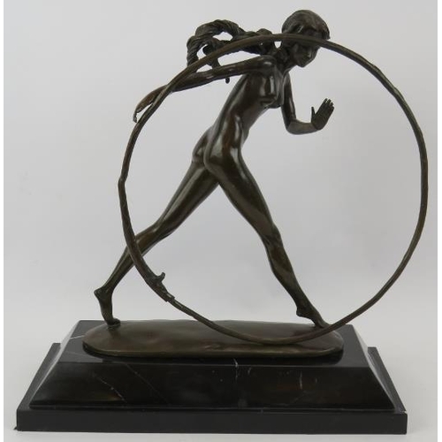 7 - A bronze figure of a nude girl with hoop mounted on a black marble plinth, unsigned. Height 43cm.
Co... 