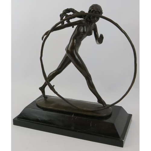 7 - A bronze figure of a nude girl with hoop mounted on a black marble plinth, unsigned. Height 43cm.
Co... 