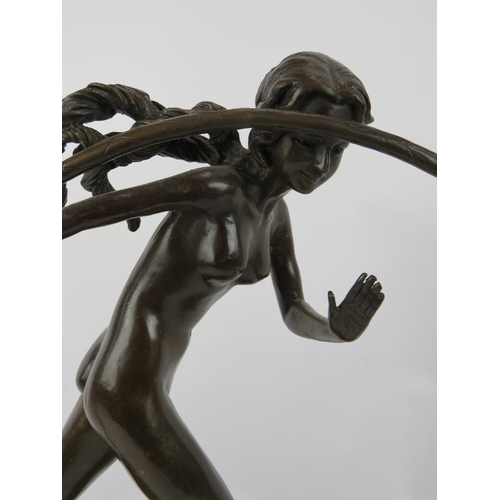 7 - A bronze figure of a nude girl with hoop mounted on a black marble plinth, unsigned. Height 43cm.
Co... 