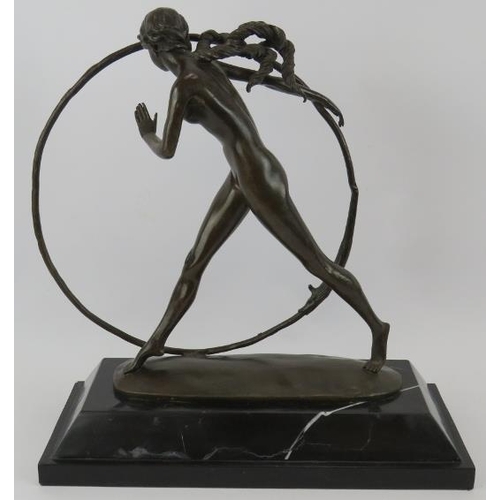 7 - A bronze figure of a nude girl with hoop mounted on a black marble plinth, unsigned. Height 43cm.
Co... 