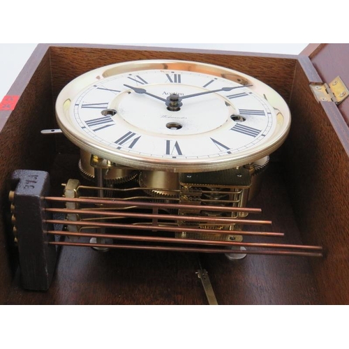 71 - An Acctim Westminster chiming wall clock in mahogany case. Key & pendulum present. Height 47cm.
Cond... 