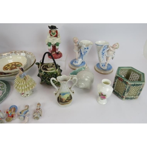 83 - A mixed lot of ceramics including a Dresden figure, Chinese porcelain plates, Majolica tea pot, etc,... 