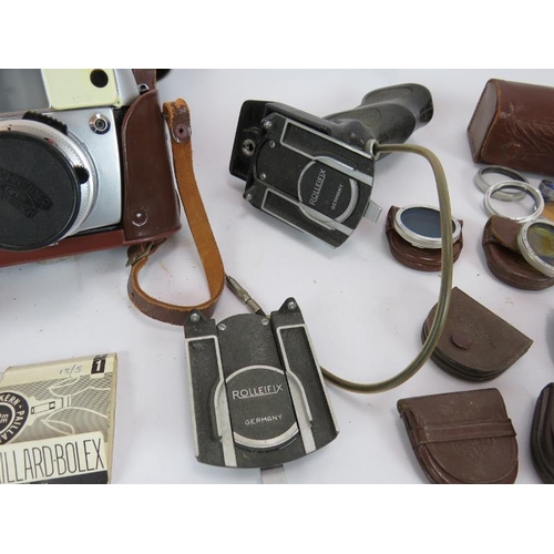 87 - A Vintage Baldamatic III camera & case with 135mm lens plus various Rolleiflex filters and accessori... 