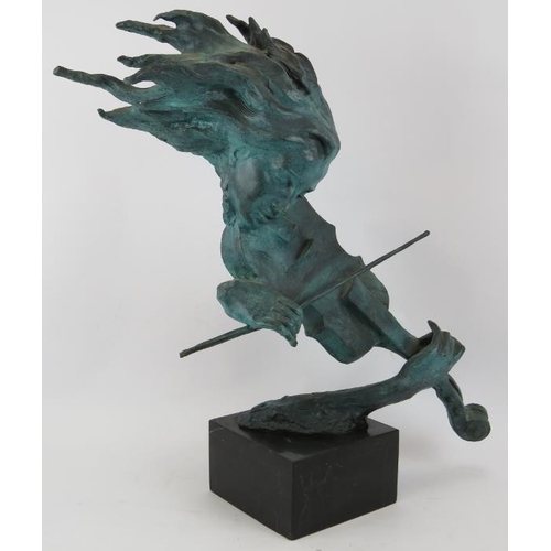 9 - A large bronze sculpture of a violinist in semi abstract form mounted on a black marble base, unsign... 