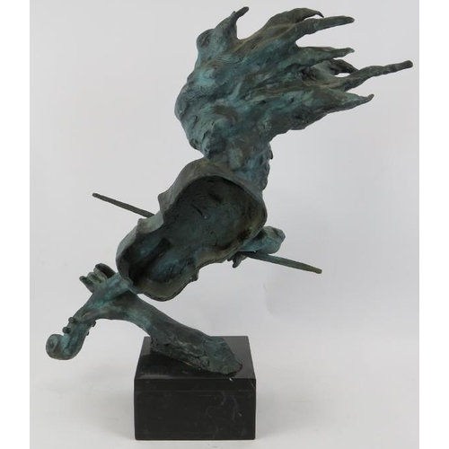 9 - A large bronze sculpture of a violinist in semi abstract form mounted on a black marble base, unsign... 