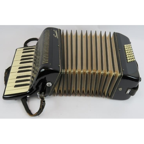 92 - A vintage Scandalli accordion in hard case. Black & ivory with 32 keys.
Condition report: Straps are... 