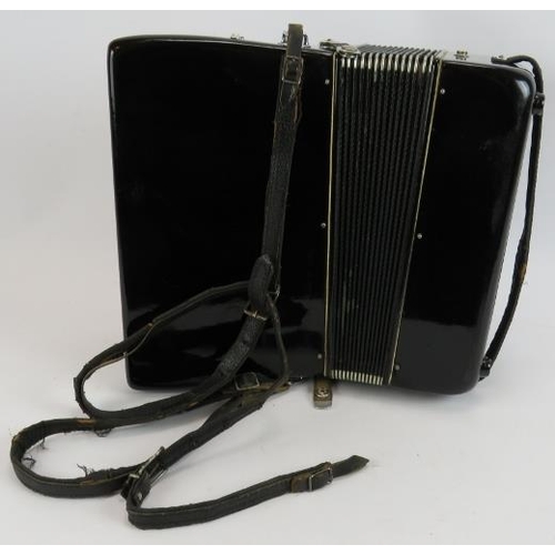 92 - A vintage Scandalli accordion in hard case. Black & ivory with 32 keys.
Condition report: Straps are... 