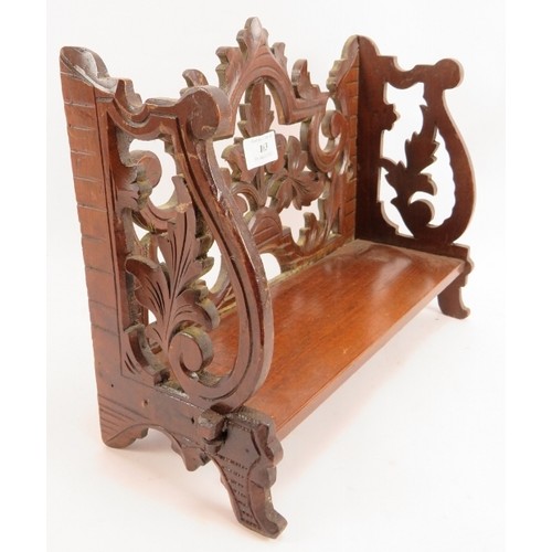 163 - A small Black Forest style carved wood wall shelf. 32cm wide, 24cm high.
Condition report: No issues... 