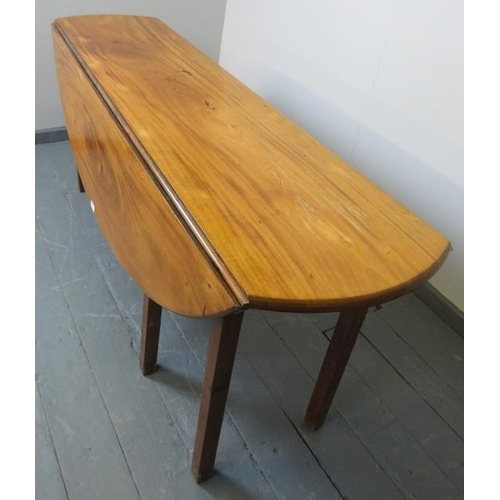 702 - A 19th century pale mahogany oval drop-leaf hunt table, on square supports. Possibly Irish. 
Conditi... 