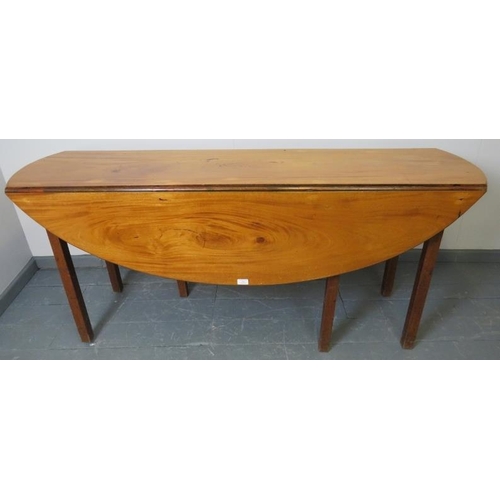 702 - A 19th century pale mahogany oval drop-leaf hunt table, on square supports. Possibly Irish. 
Conditi... 