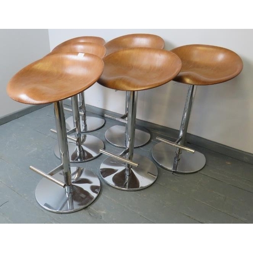 704 - A set of six contemporary plywood bar stools by Allermuir, on hydraulically height adjustable chrome... 