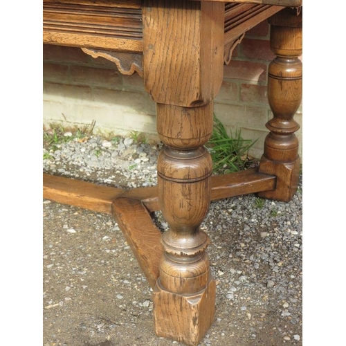 710 - A large bespoke medium oak refectory table in a 17th century taste, on baluster turned supports unit... 