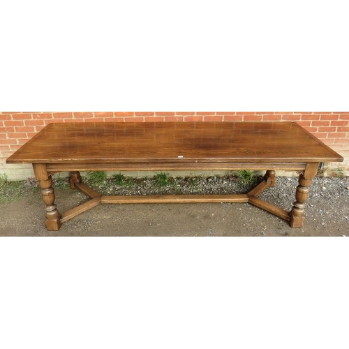 710 - A large bespoke medium oak refectory table in a 17th century taste, on baluster turned supports unit... 