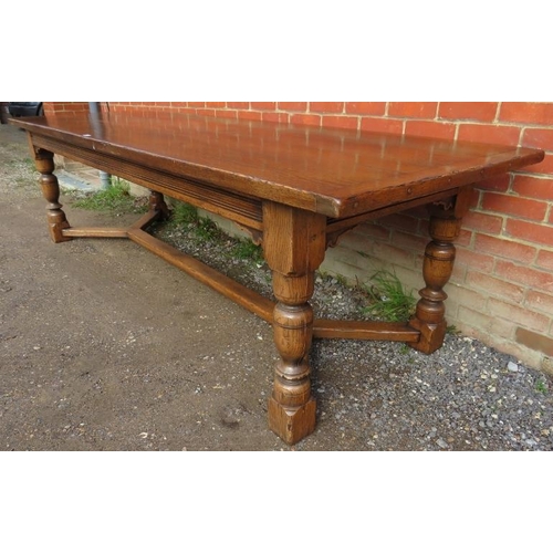 710 - A large bespoke medium oak refectory table in a 17th century taste, on baluster turned supports unit... 