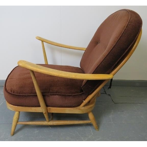 716 - A mid-century Ercol Windsor 203 blond armchair, with loose seat cushions in brown draylon. 
Conditio... 