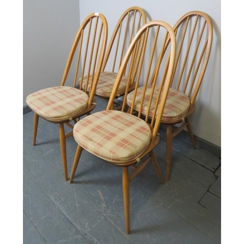 721 - A set of four mid-century Ercol blonde Windsor Quaker dining chairs, with detachable seat cushions i... 