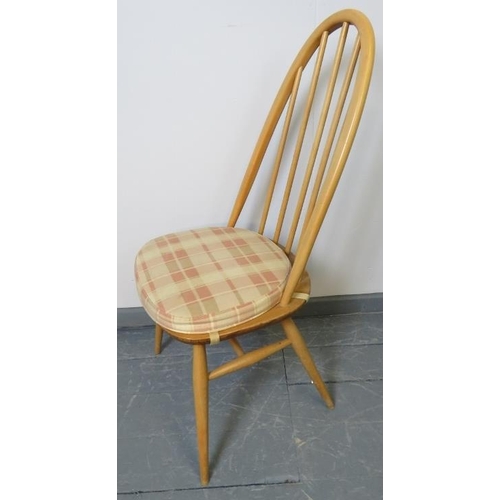 721 - A set of four mid-century Ercol blonde Windsor Quaker dining chairs, with detachable seat cushions i... 