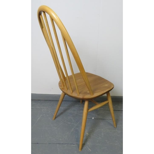 721 - A set of four mid-century Ercol blonde Windsor Quaker dining chairs, with detachable seat cushions i... 