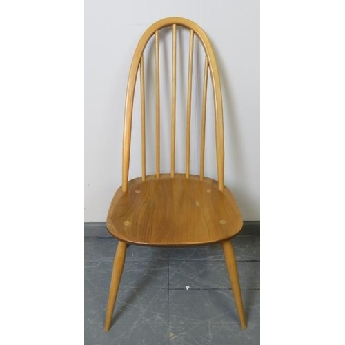 721 - A set of four mid-century Ercol blonde Windsor Quaker dining chairs, with detachable seat cushions i... 