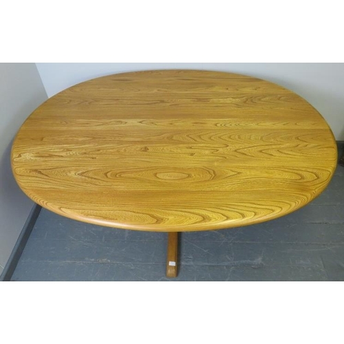 722 - An Ercol ash blonde Southwold oval dining table, on a quatreform pedestal base.
H73cm W163cm D123cm ... 