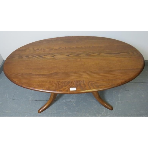 723 - A Ercol ash golden dawn Chester 1191 oval coffee table, on splayed supports. 
Condition report: No i... 