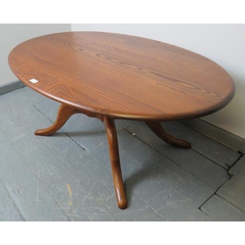 723 - A Ercol ash golden dawn Chester 1191 oval coffee table, on splayed supports. 
Condition report: No i... 