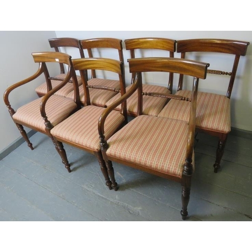 728 - Seven (5+2) George III mahogany dining chairs, with scrolled backrests and rope twist stretcher, uph... 