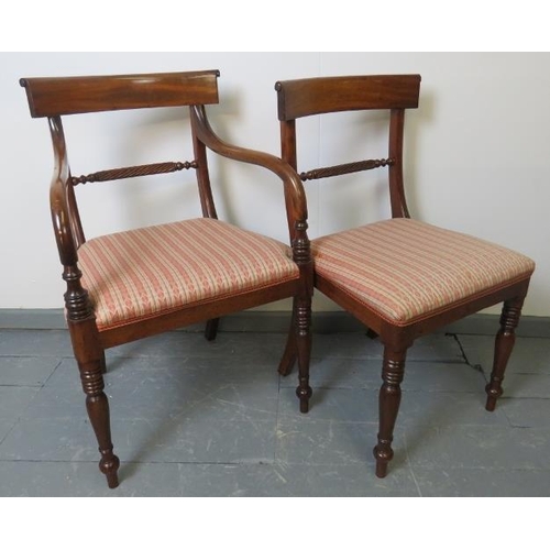 728 - Seven (5+2) George III mahogany dining chairs, with scrolled backrests and rope twist stretcher, uph... 