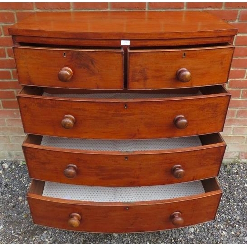 730 - A Georgian mahogany bowfront chest of two short over three long cock beaded drawers, retaining the o... 