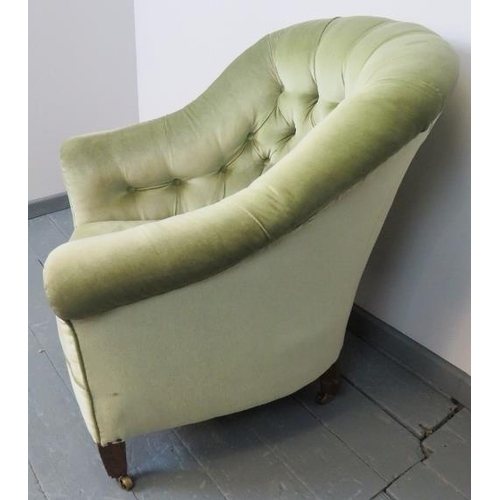 738 - A turn of the century button back armchair, upholstered in green velvet, on tapering square supports... 