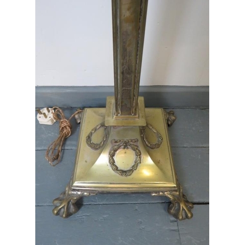 739 - An Edwardian heavy brass standard lamp, with a square column, on a plinth base in the Neo-Classical ... 