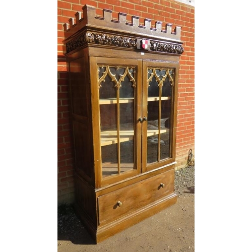 742 - A 19th century mahogany Gothic revival linen press, with ornately carved and castellated cornice and... 