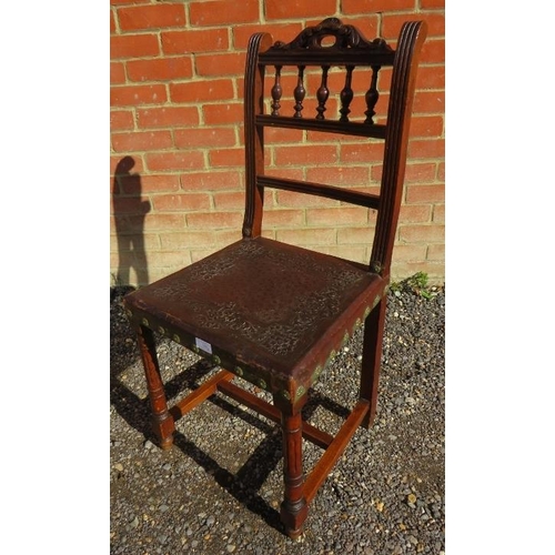 743 - Five Edwardian oak dining chairs with embossed leather seats, on reeded supports with stretchers, an... 