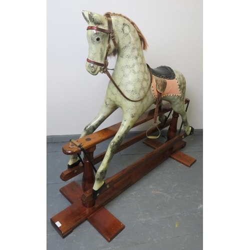 745 - A vintage dapple grey rocking horse, with leather reigns, bridle & saddle and real horsehair mane & ... 