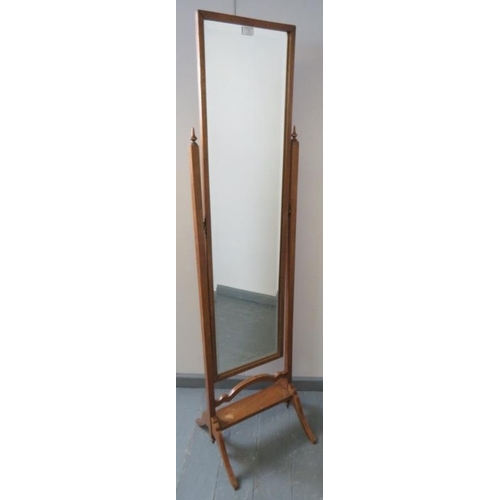 747 - An Edwardian oak bevelled cheval mirror, with square uprights and turned finials, on splayed support... 